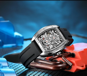 Detailed close-up of tonneau-shaped mechanical watch with skeleton dial and black silicone strap