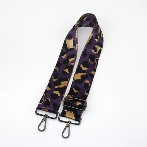 Detail of adjustable purple leopard print wide bag strap with gunmetal lobster clasps