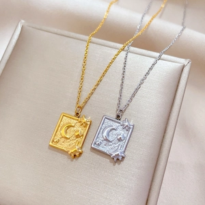 Gold and silver planet necklaces with embossed star and moon card pendants