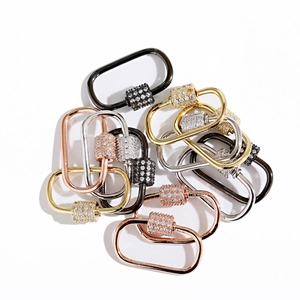 Detail of 18K gold micro-pave carabiner clasps with cubic zirconia in four metal finishes