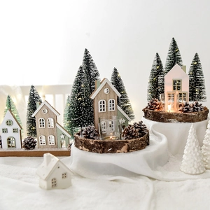 Lighted wooden house ornament with mini Christmas trees for festive tabletop decor