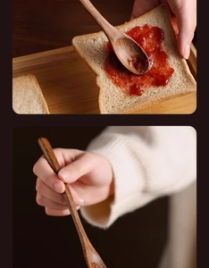 Macro view of natural grain long handle wooden spoon spreading jam on toast
