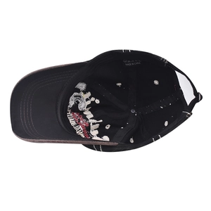 Detailed interior view of a washed black baseball cap with inner embroidery and wash label