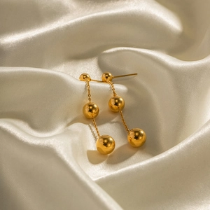 Boucles d'oreilles minimalistes en acier inoxydable plaqué or 18K à trois billes
