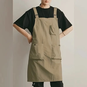 Waterproof khaki work apron with H-back straps and multiple pockets for cafe or kitchen