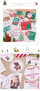 Detail of diverse Christmas gift tags with festive icons like Santa and gingerbread man