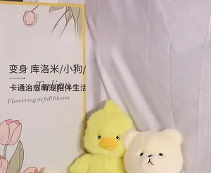 Detail of plush animal toy series featuring chick and dog characters in a cozy indoor setting