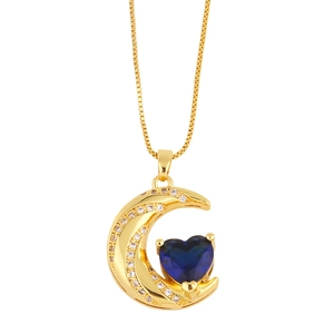 Gold moon and heart necklace featuring sparkling cubic zirconia and deep blue crystal