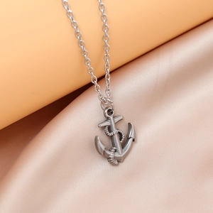 Silver stainless steel anchor pendant necklace with rope detail on soft silk fabric