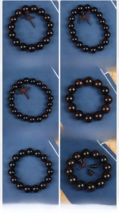 Macro detail of African Blackwood Buddhist prayer beads in six various sizes and styles