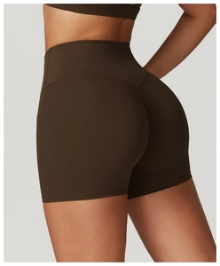 Detail of high-waist dark brown yoga shorts featuring V-shape back seam for butt lifting