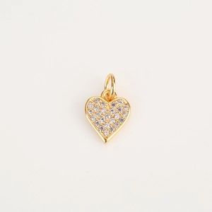Detailed view of heart shaped golden pendant with inlaid clear zircon and small hanging loop