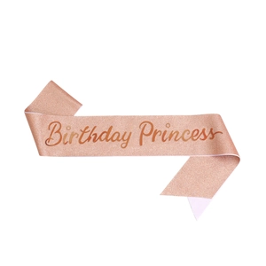 Close-up of rose gold glitter fabric sash with Birthday Princess lettering for girls