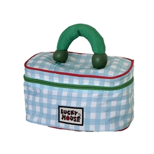 Blue and white checkered travel makeup bag with green handle and Lucky House label