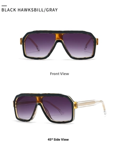Detail of vintage square sunglasses with tortoiseshell accents and clear temples