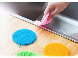 Detailed view of colorful silicone dish brushes with soft bristles for kitchen cleaning