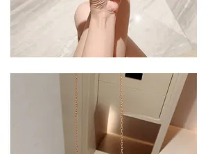 Close-up of polished gold metal chain strap featuring high-shine oval link craftsmanship