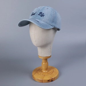 Light blue denim baseball cap with Good Life embroidery on a display mannequin