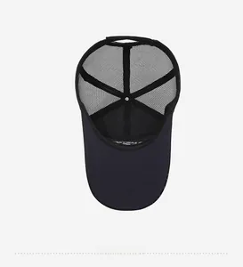 Internal structure of black mesh trucker hat showing breathable material and seams