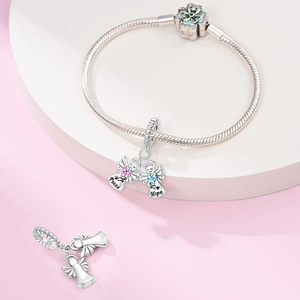 Detailed view of silver angel charms engraved with Peace and Hope on snake chain