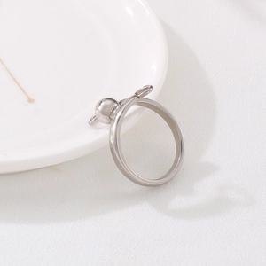 Minimalist silver stainless steel ring with elegant bead and bow tie design