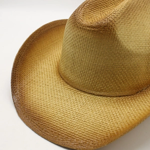 Detail of western cowboy straw hat showing tight weave and vintage burnt edge finish