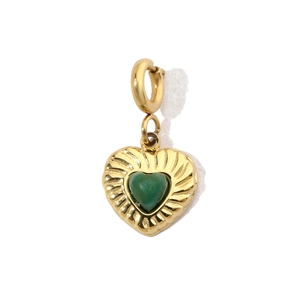 Detail of gold-plated stainless steel heart pendant with vibrant green natural stone