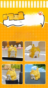 Orange wood-carved style cat resin figurine displayed on desk and car dashboard