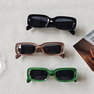 Retro rectangular sunglasses in black, transparent brown, and emerald green finishes