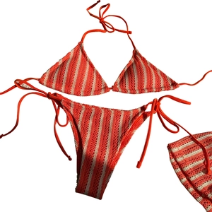 Three-piece striped crochet bikini set with halter top and side-tie bottoms in orange