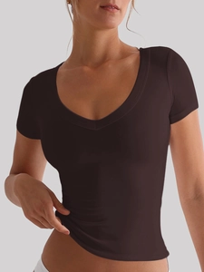 Close-up of a deep brown V-neck short-sleeved t-shirt on a model against a grey background