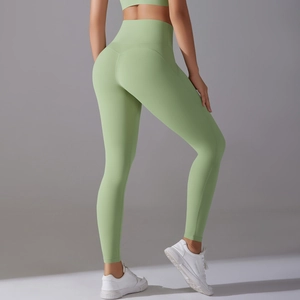 Close-up of light green high-waisted yoga pants with squat-proof and seamless sculpting design
