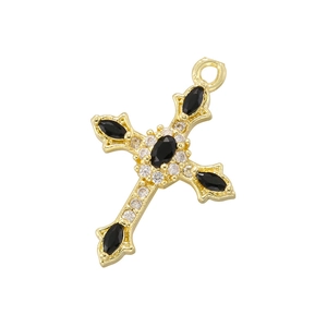 Golden cross pendant with black oval gemstones and round crystals on white background