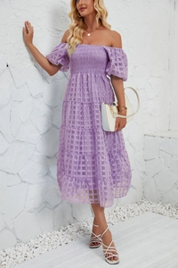 Detail of purple off-shoulder tiered maxi dress with smocking and grid texture
