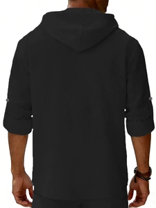 Detail view of the back of a black linen hooded shirt for men with adjustable sleeves