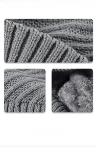 Detail of dark grey knitted hat showing thick fleece lining and intricate jacquard texture