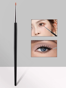 Detailed precision eyeliner brush with fine red-brown bristles for eye makeup