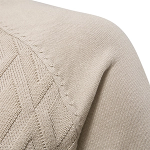 Close-up of geometric jacquard knit texture on casual men sweater in beige coffee color