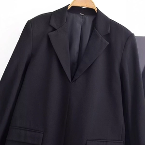 Elegant black blazer dress with lace hem, minimalist single-breasted design for women