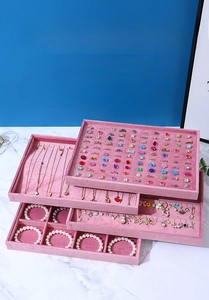 Detailed view of pink velvet jewelry organizer trays set for rings and necklaces display