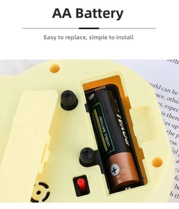 Detailed back view showing the AA battery compartment and power switch of the motorcycle clock