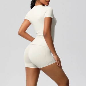 Close-up of high-waist yoga shorts with side pocket showing side seam and fabric texture