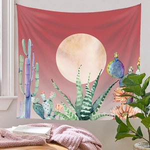 Artistic wall tapestry showing a desert landscape with full moon and cacti in pink tones