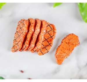 Detailed view of artificial grilled beef steak model with grill marks on marble