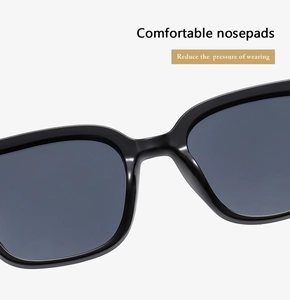 Detail of ergonomic integrated nose pads on black square sunglasses for comfort