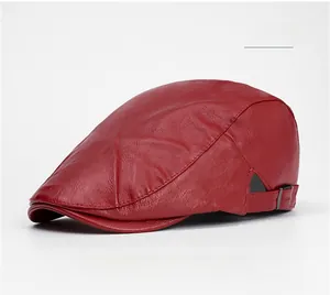 Detail of red PU leather flat cap showing the metallic adjustable buckle and stitching