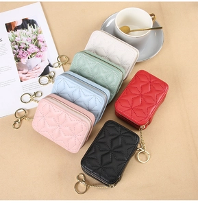 Detail view of mini diamond-quilted PU leather lipstick bags in five trendy colors