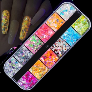 Close-up of 12-grid nail art sequins with laser butterfly and fluorescent glitter shapes