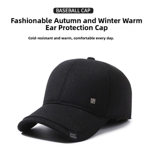 Detail of black winter baseball cap with ear flaps and Sport Fashion textile label
