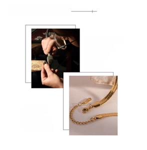 Macro detail of 18K gold plated herringbone snake chain with polished mirror finish surface